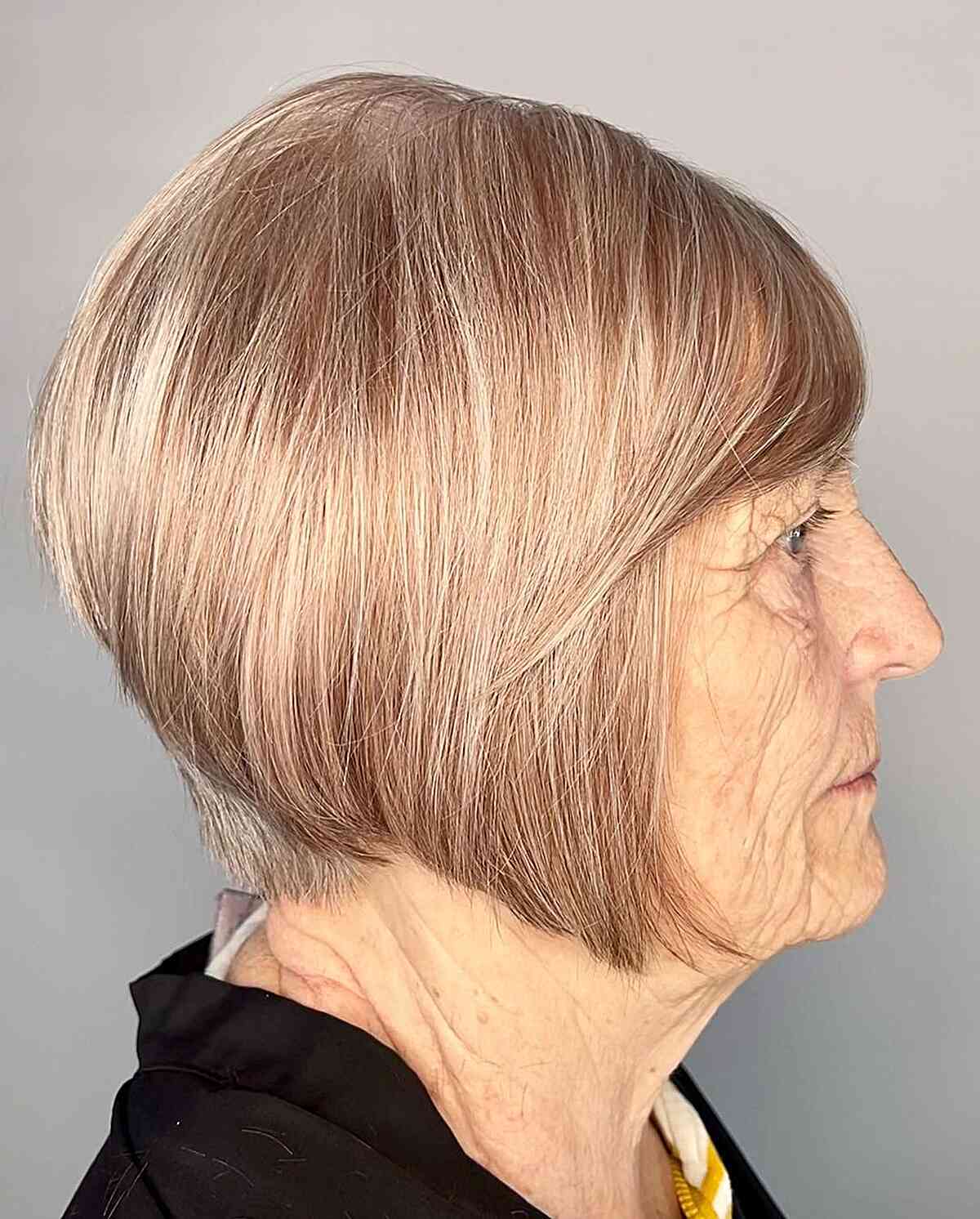 jaw length a line bob with bangs and tapered nape for senior women over sixty