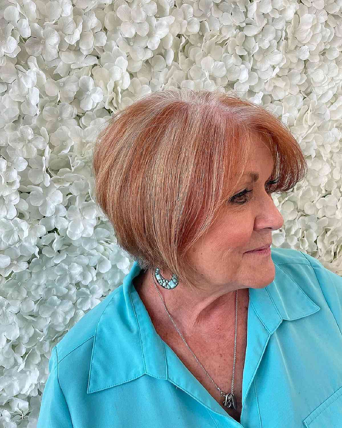 jaw length angled bob for older ladies aged 70 with copper highlights