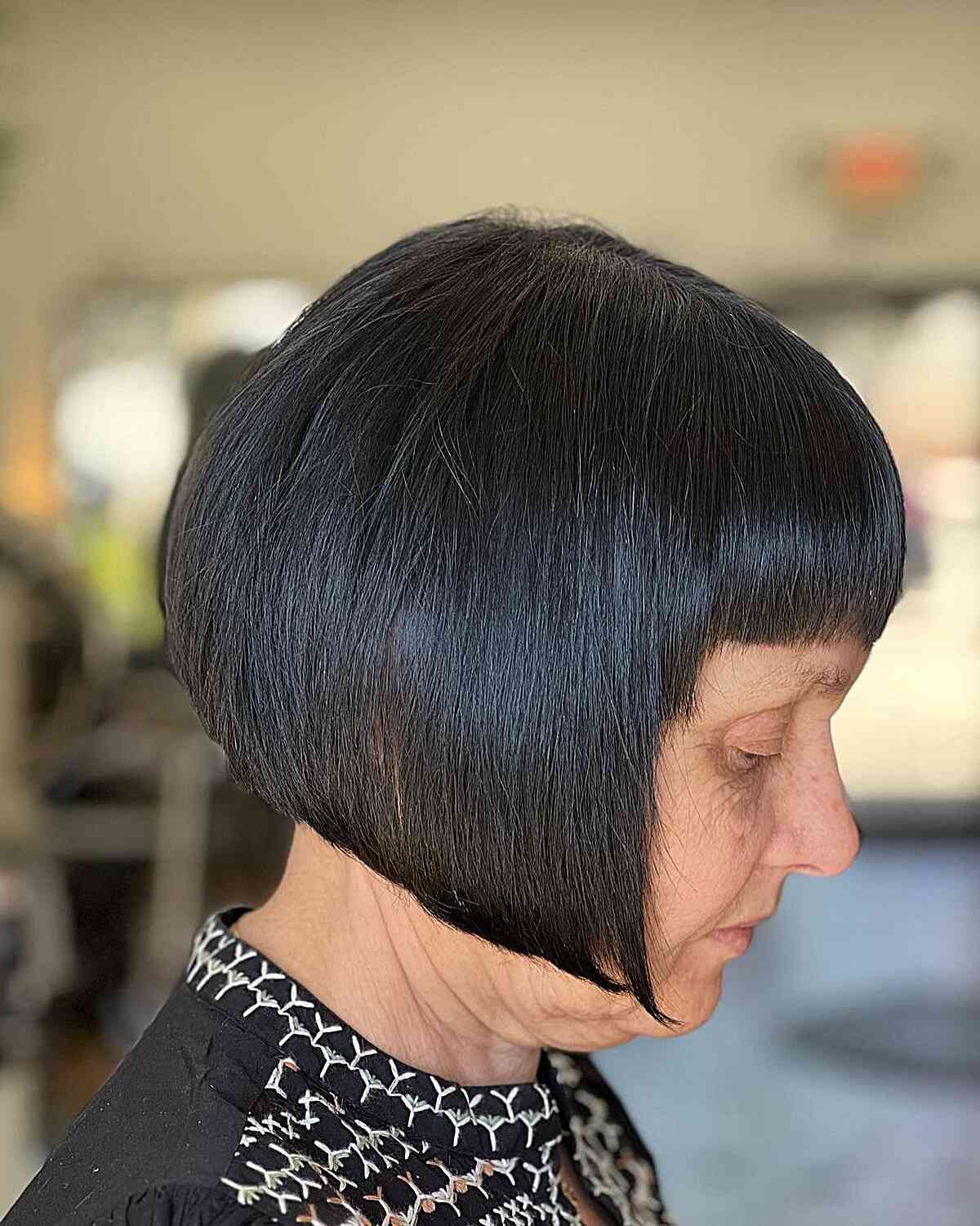 jaw length face framing bob with short bangs for older ladies over 60