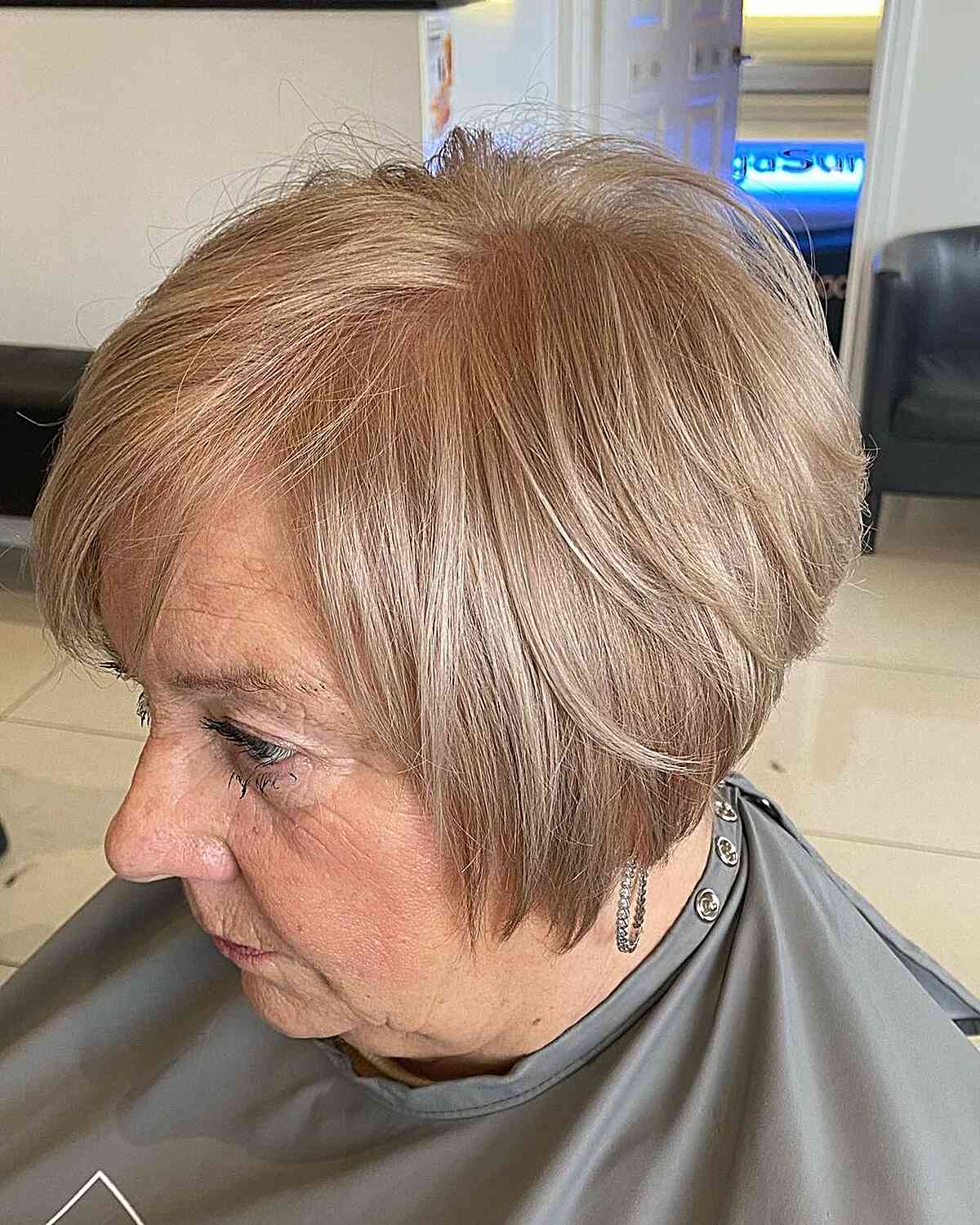 jaw length mini layered bob with beige blonde color for 60 year olds