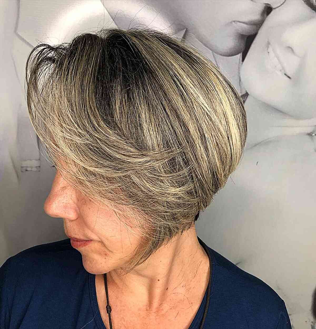 jaw length rooted bob with long side bangs for women past 60