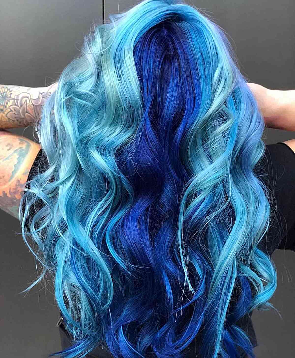 light and dark blue balayage tints for long wavy mermaid hair
