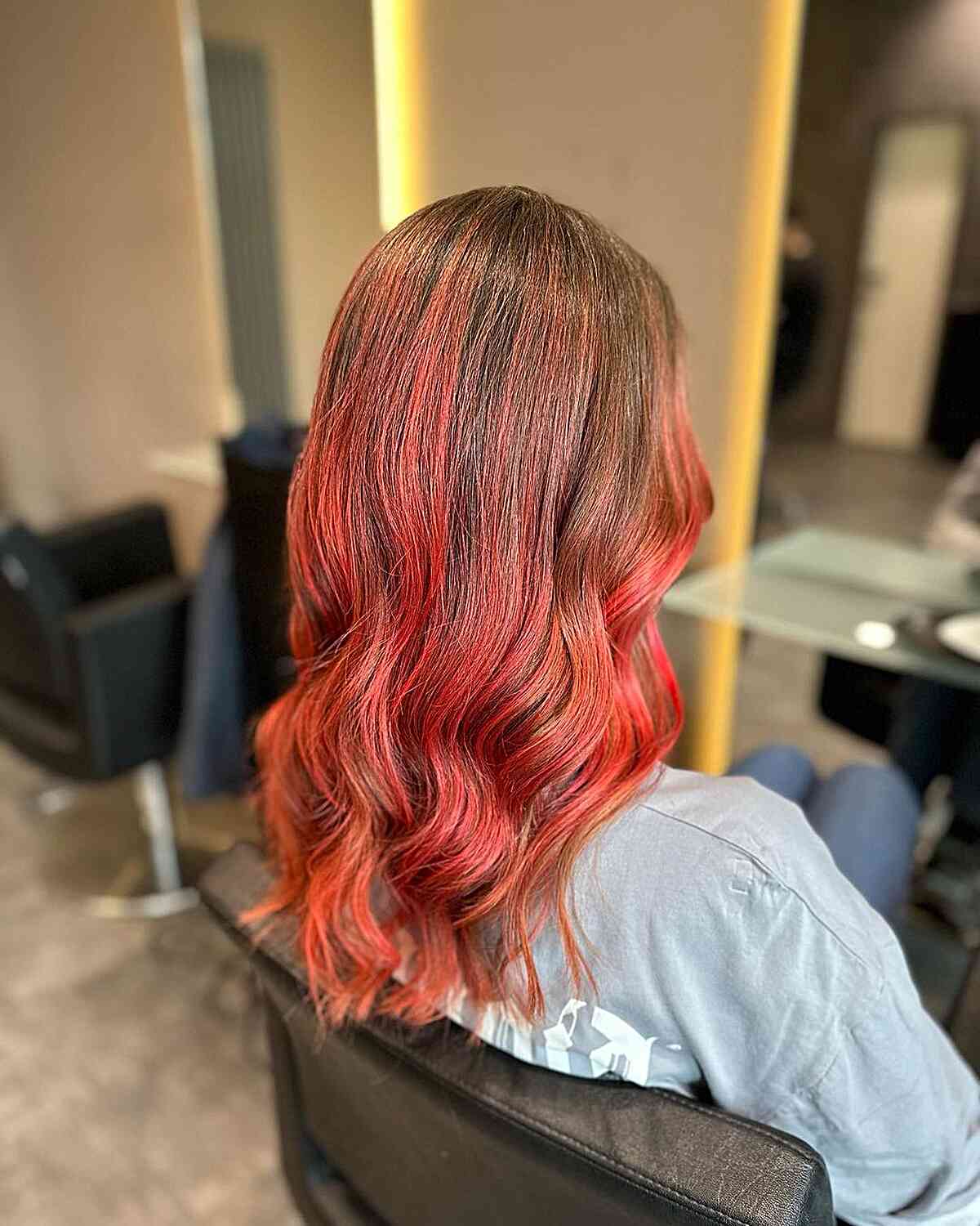 light brown hair with bright red balayage highlights