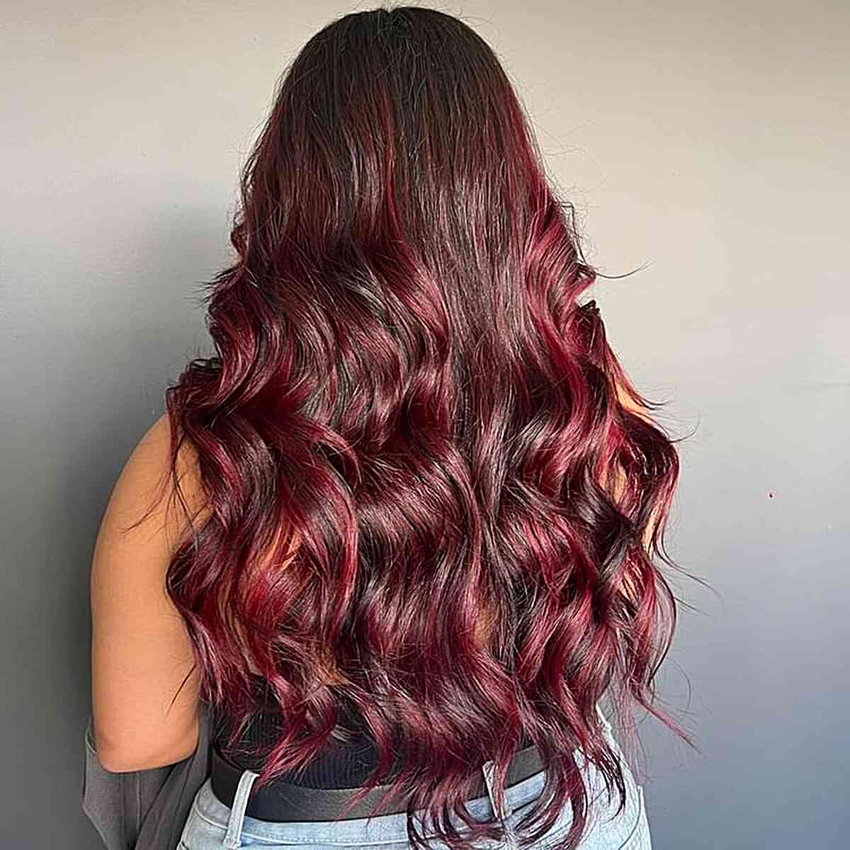 long wavy red wine balayage ombre highlights on dark brown hair