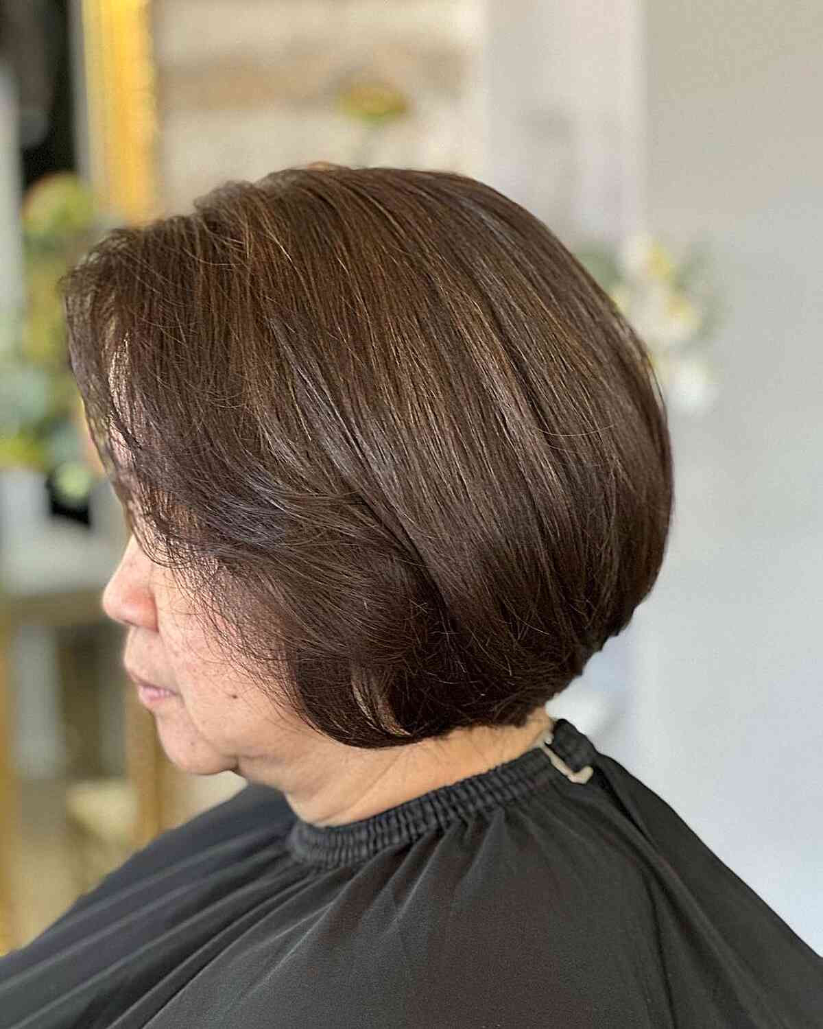 low maintenance jaw length inverted brown bob for ladies aged 60
