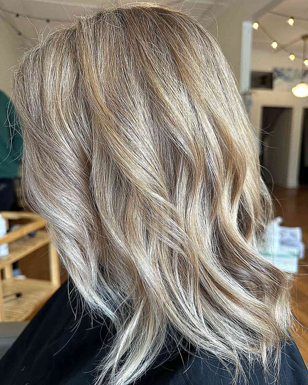 medium length dirty vanilla blonde balayage with subtle layers