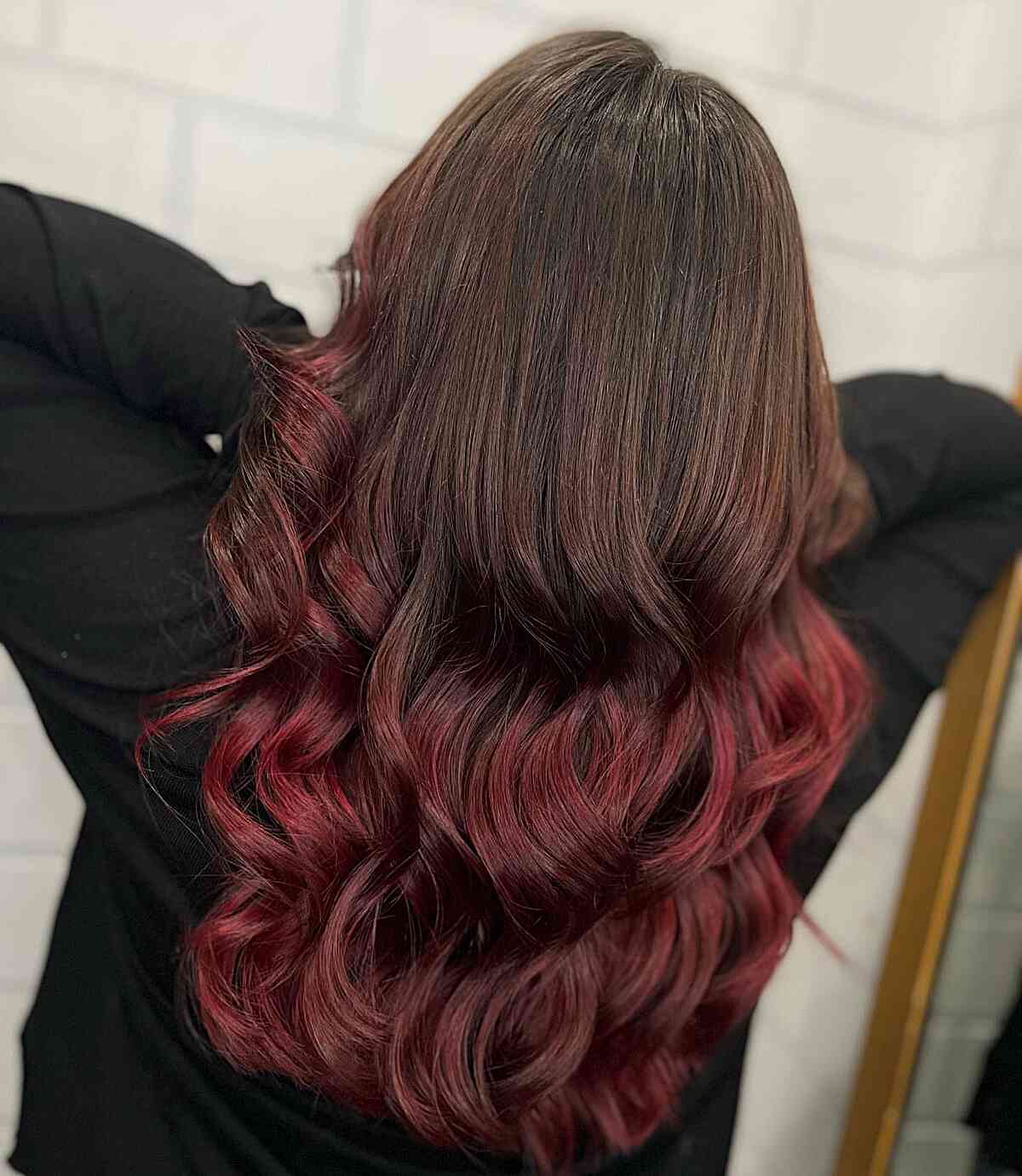 melted brown to burgundy red balayage hues