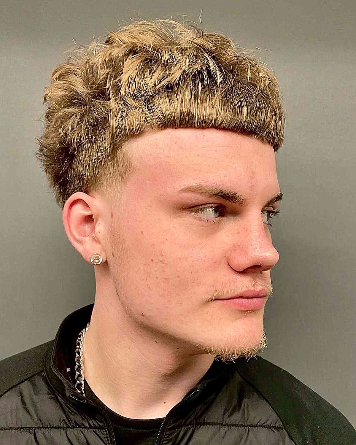 messy edgar style with straight bangs for men