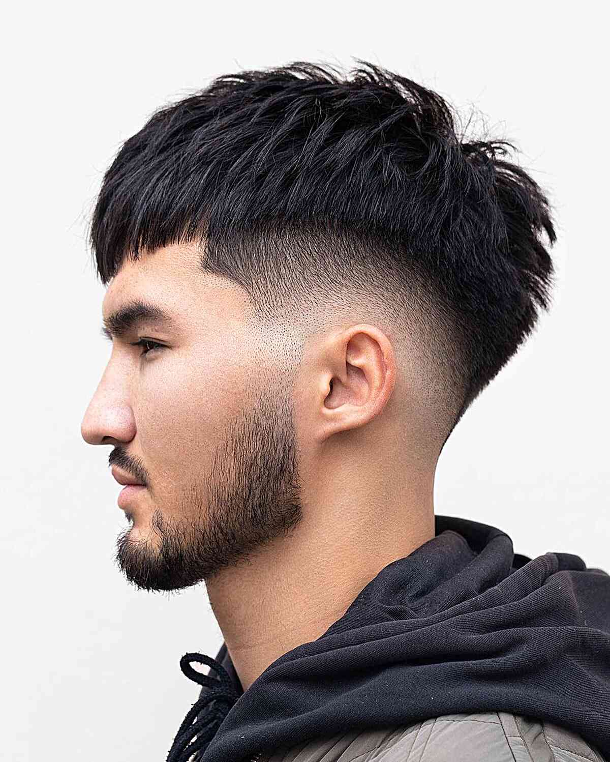 mid fade edgar cut with piecey texture on males