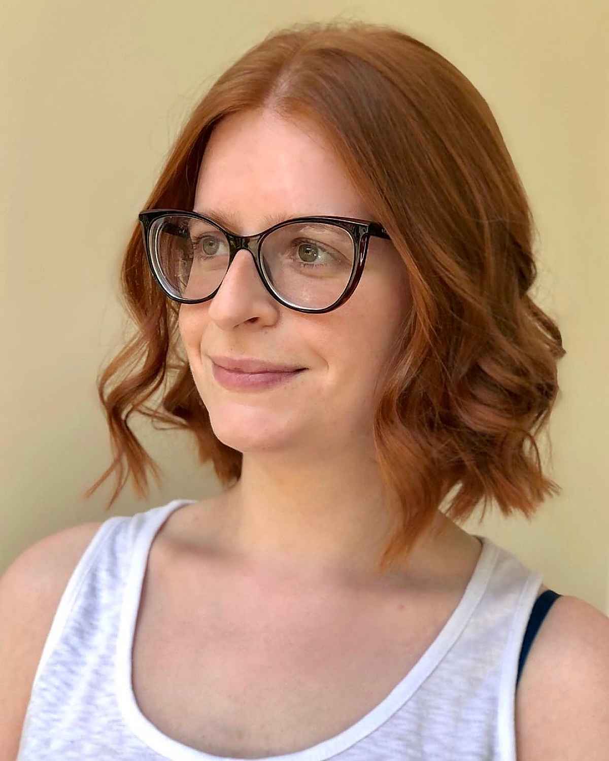 middle parted lob with curls for women over 40 with thin hair
