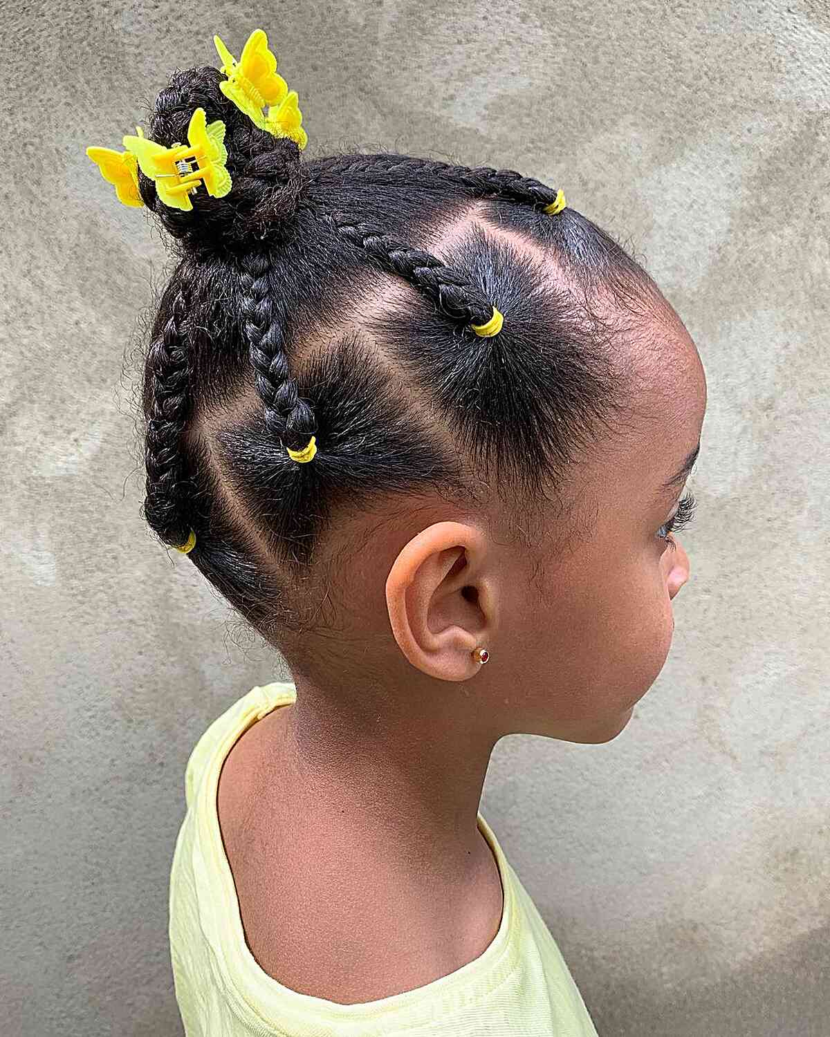mini braids and bantu knot with yellow clips for black girl toddlers