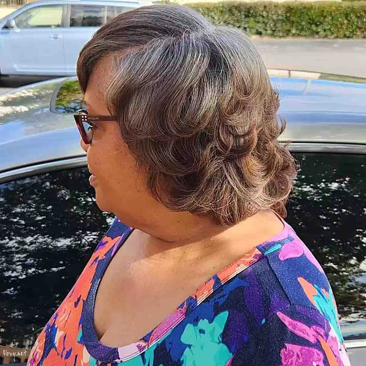 neck length cut with short feathered flipped layers on black women over 60