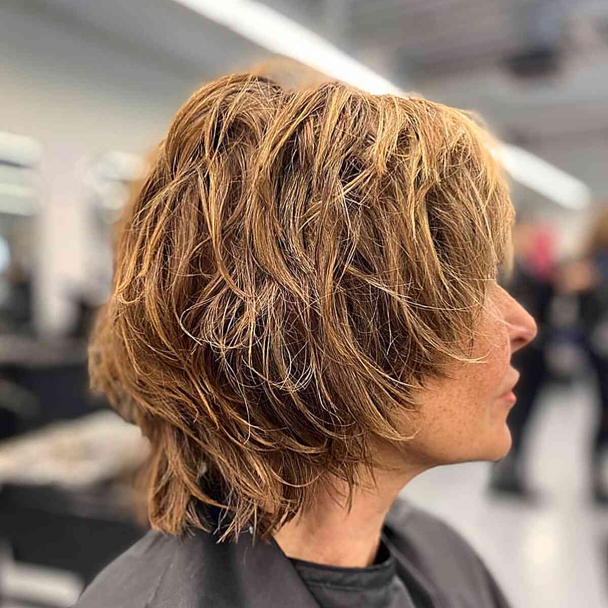 neck length messy shagged short cut for older women
