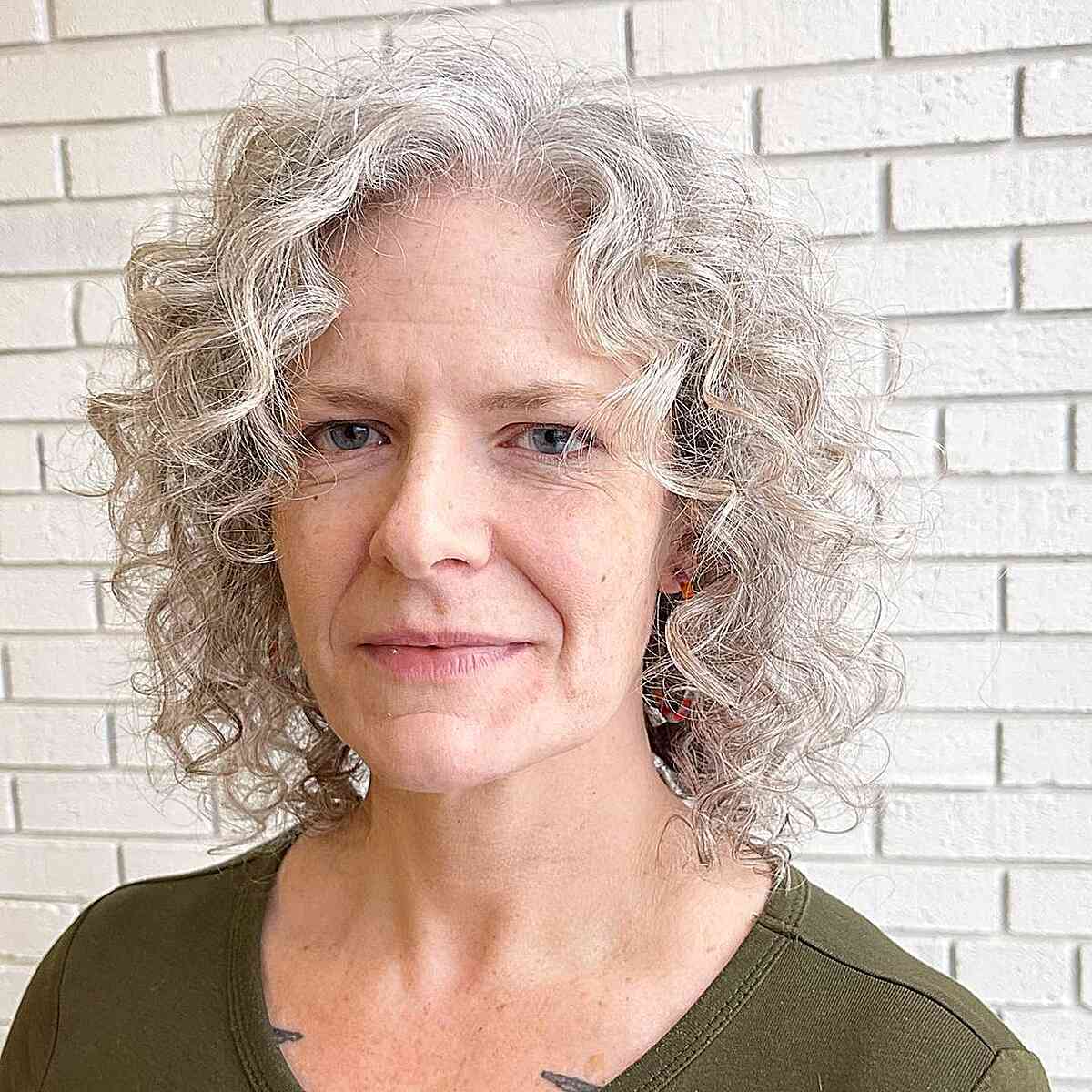 neck length white curly shag bob on older ladies