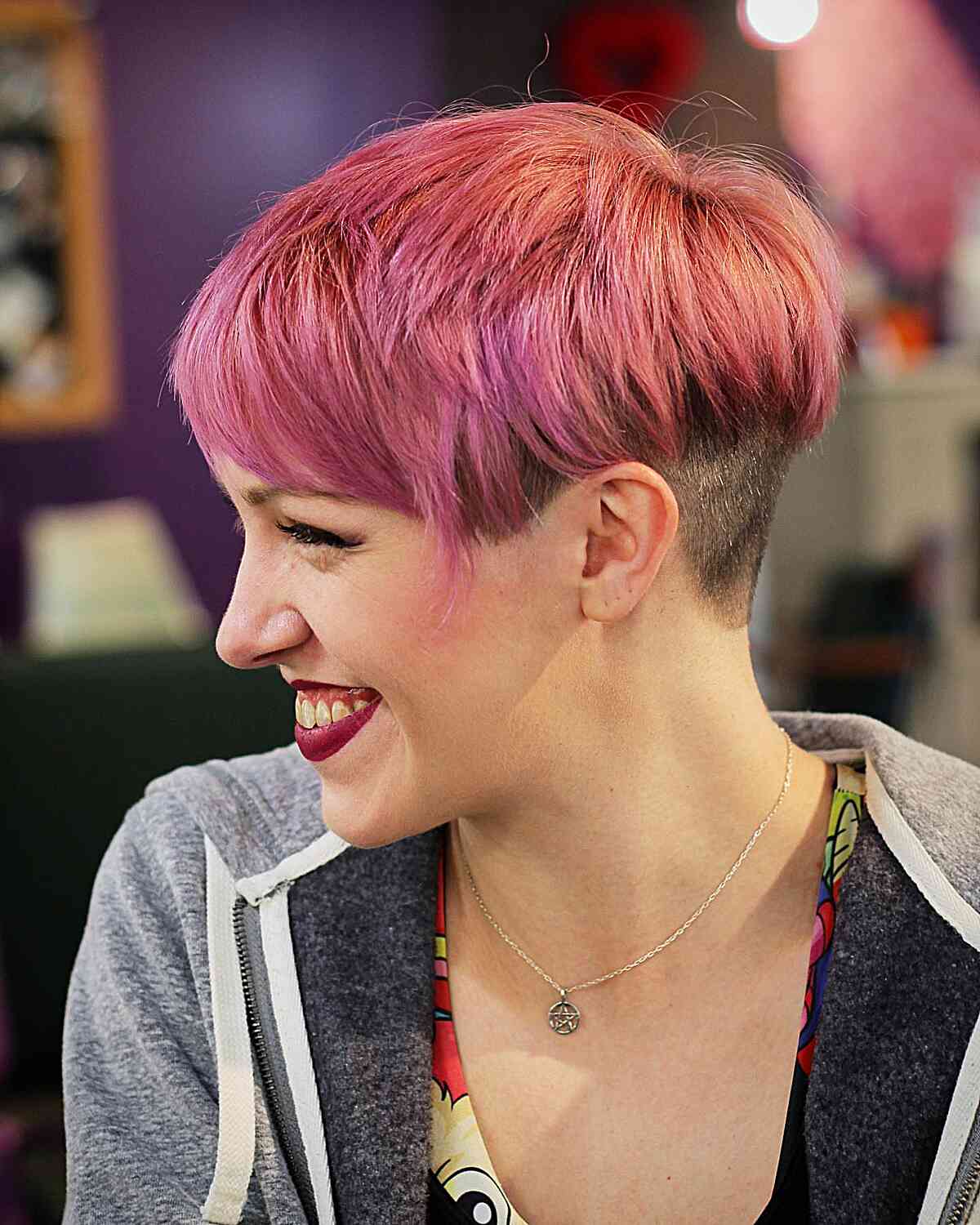 pink bixie with an undercut and bangs