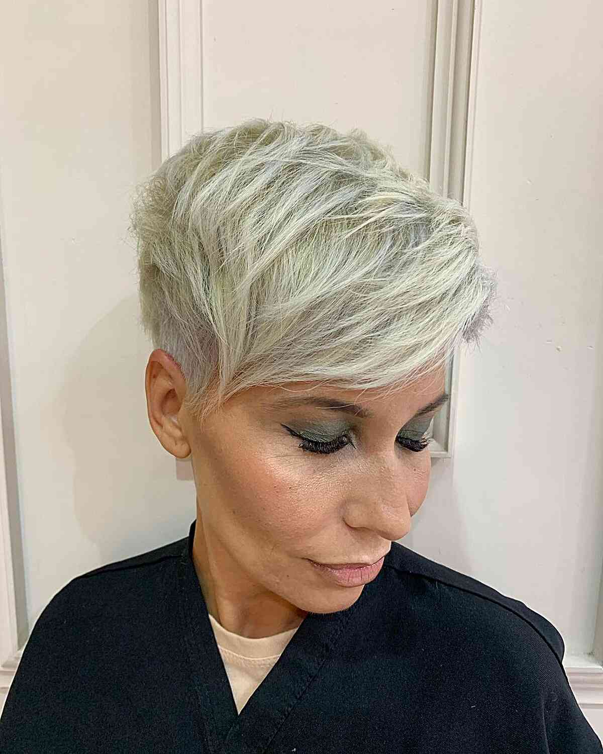 platinum pixie with an undercut and sweeping bangs