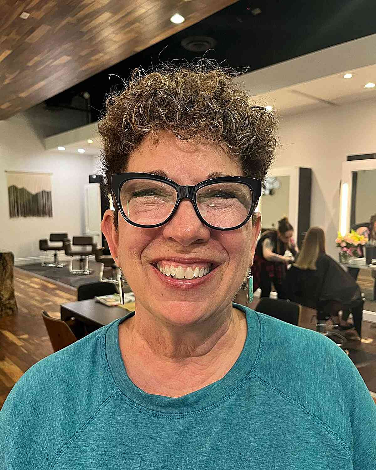 short curly balayage pixie cut with short sides for old ladies wearing glasses