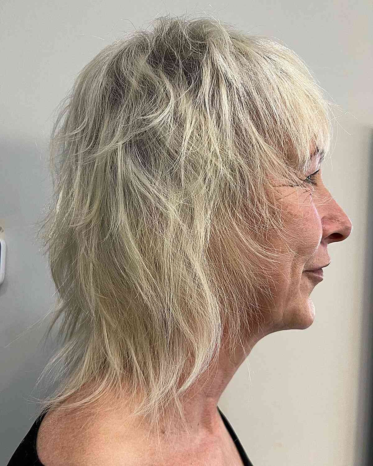 short length modern mullet with shaggy layers for older women