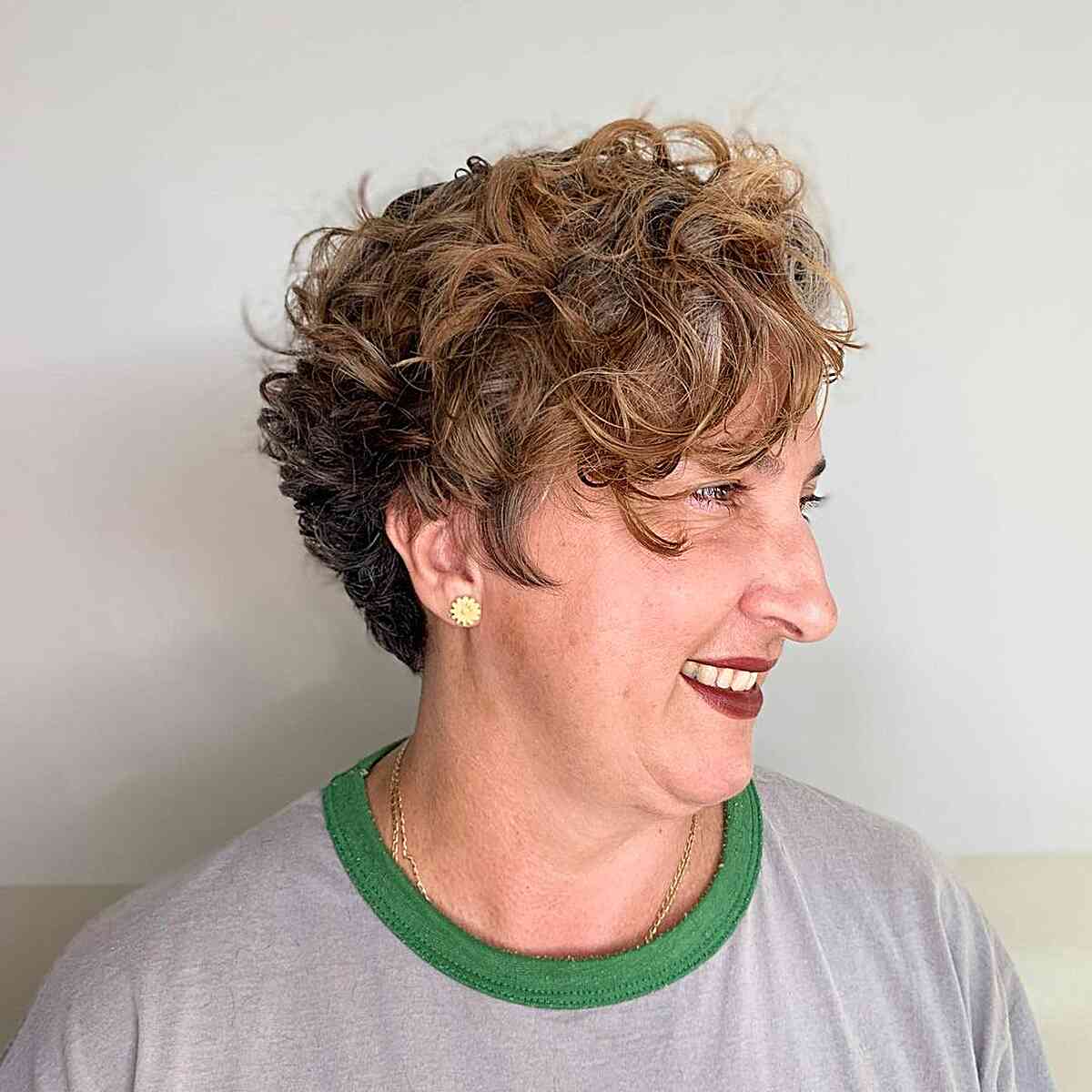 short messy pixie with piecey layers and curls for older ladies
