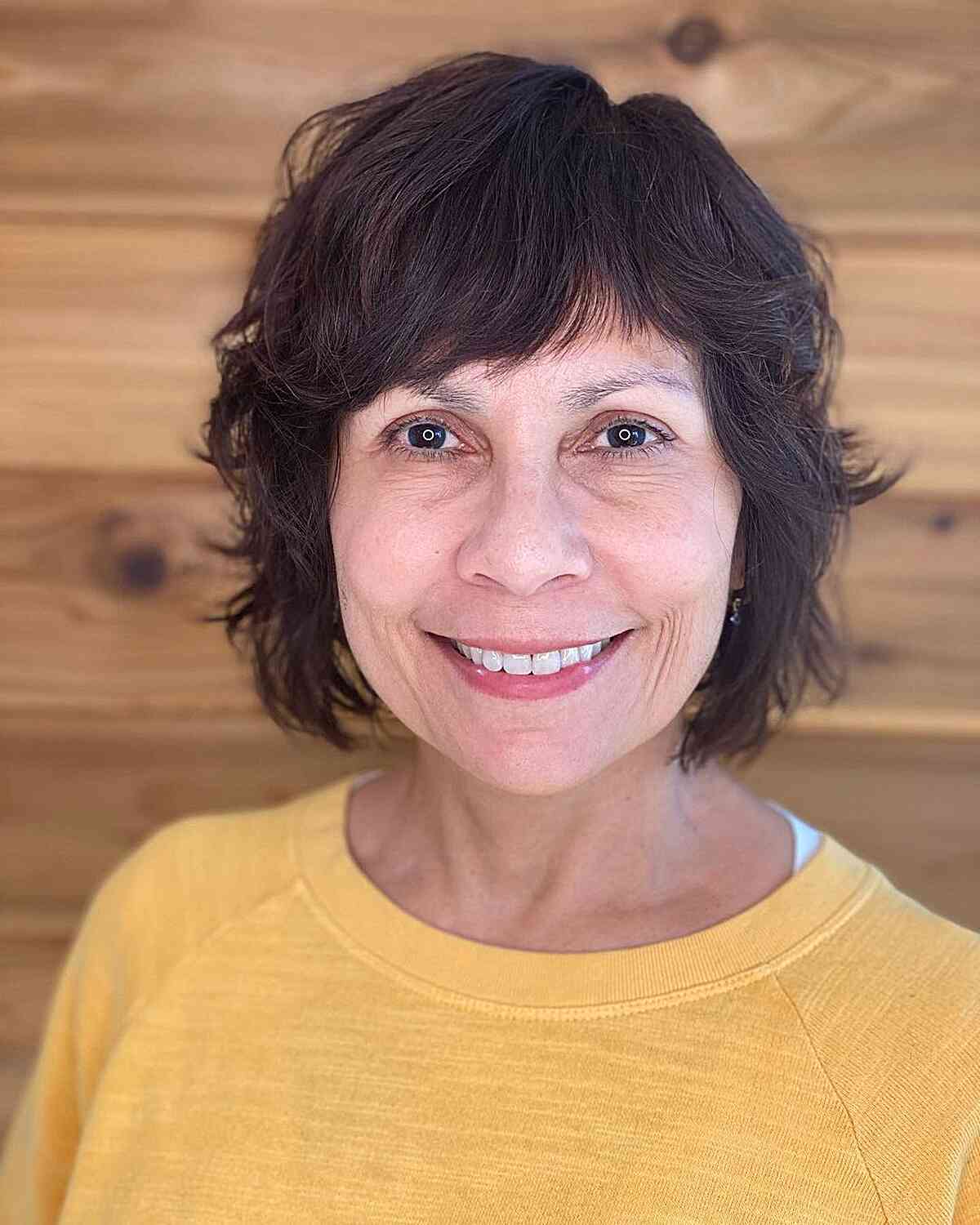 short shaggy bob with disconnected layers for older women