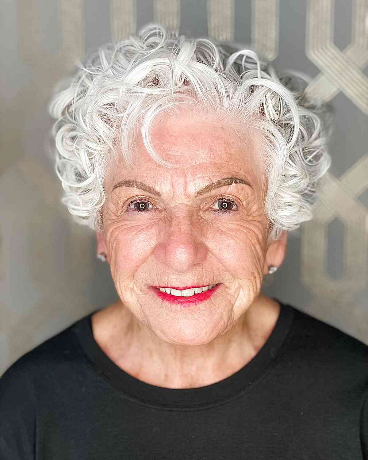 short side parted white curly layered pixie for older women