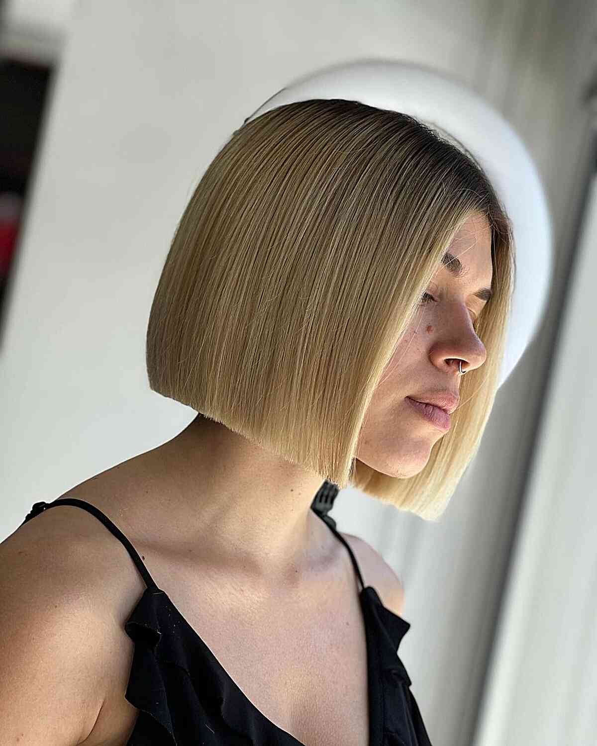 short sleek slob cut bob with full blonde highlights