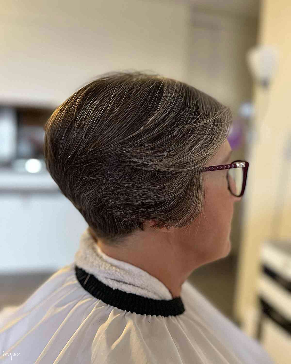 short soft feathered layered pixie cut with tapered nape for women over 60