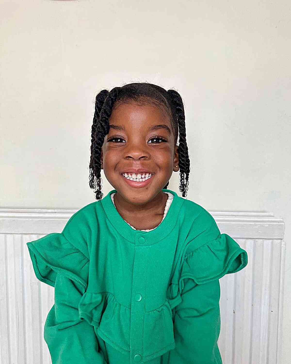 short updo with twists and beads for little black girls