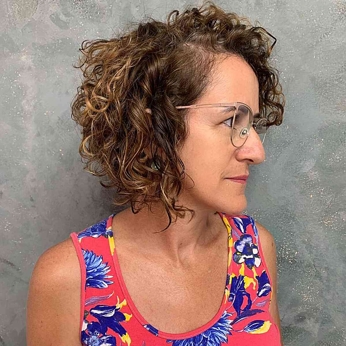 side part stacked curly haircut for mature ladies