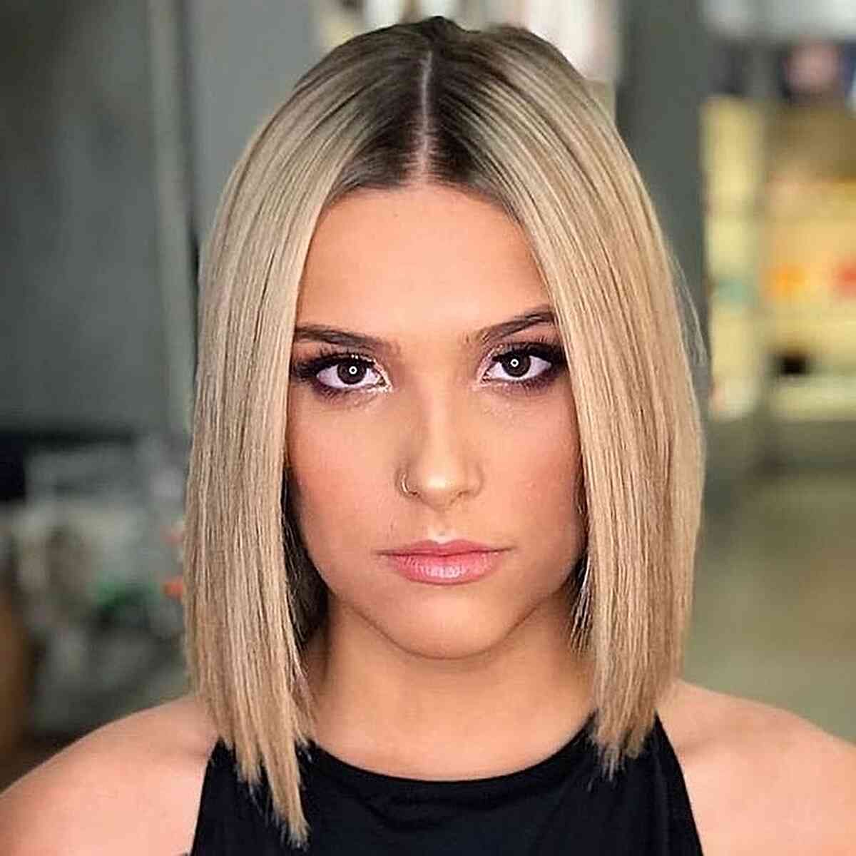 sleek long bob slob hairstyle with sharp edges