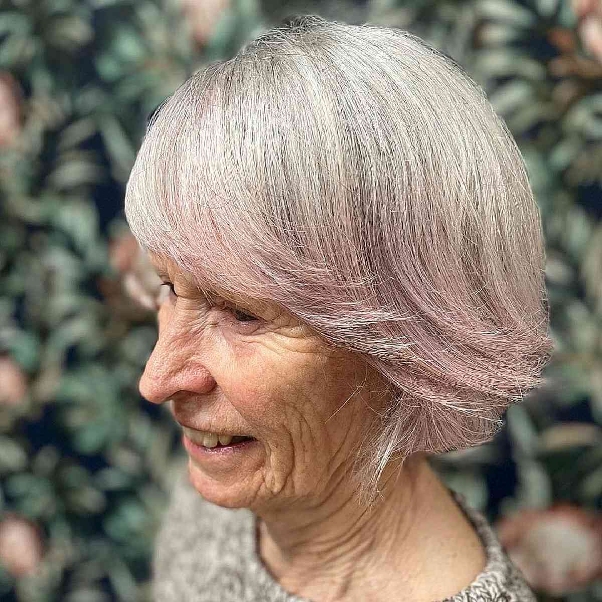 soft razor cut bob for ladies turning 70 with full bangs