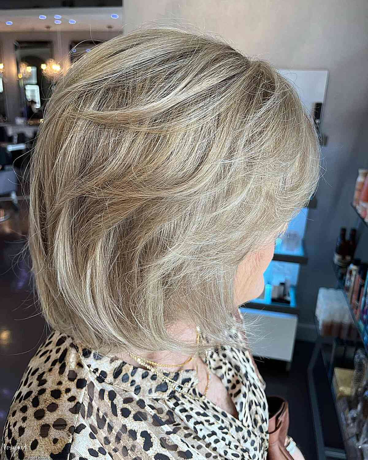 swept feathered layers for lob cut on women aged 60
