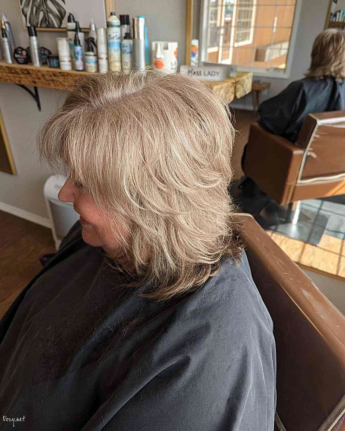 textured shoulder length cut with feathered chopped layers on ladies over sixty