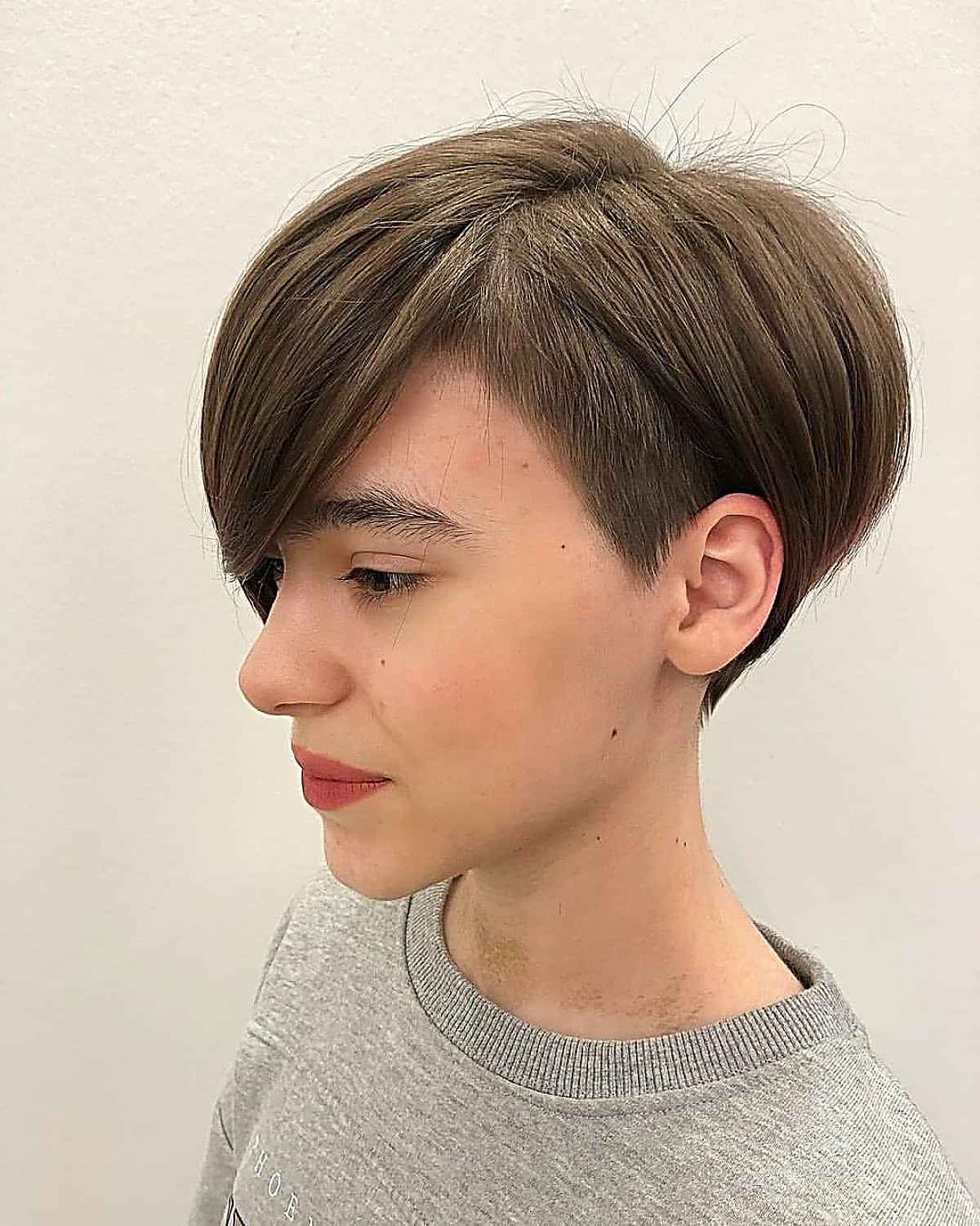 undercut pixie bob with long side bangs