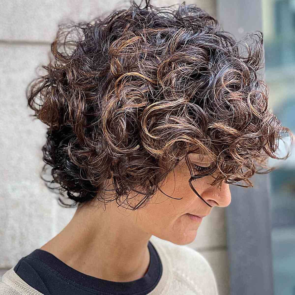 very short layered bob with big curls for mature older ladies