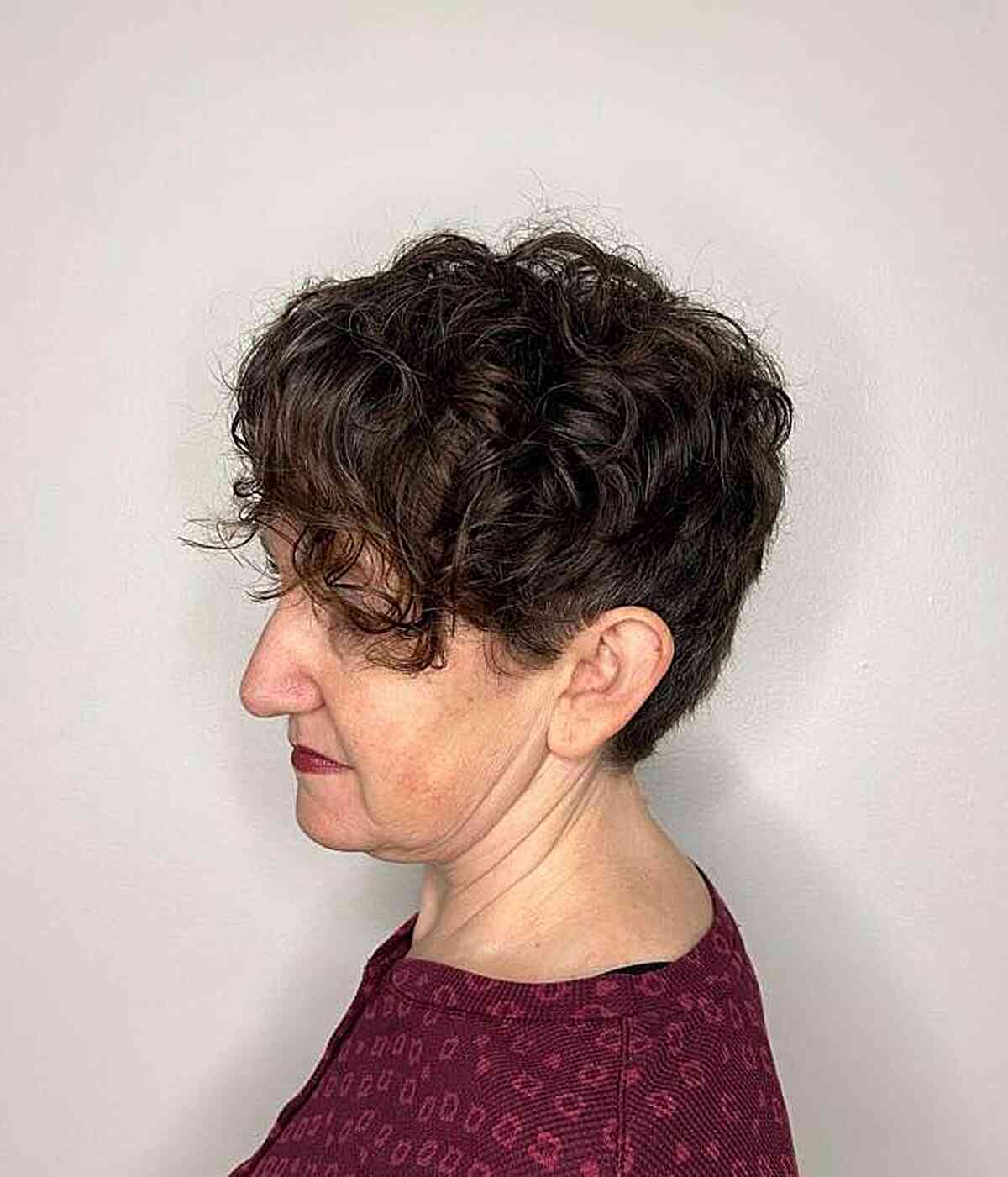 very short tapered curls with side fringe for older women