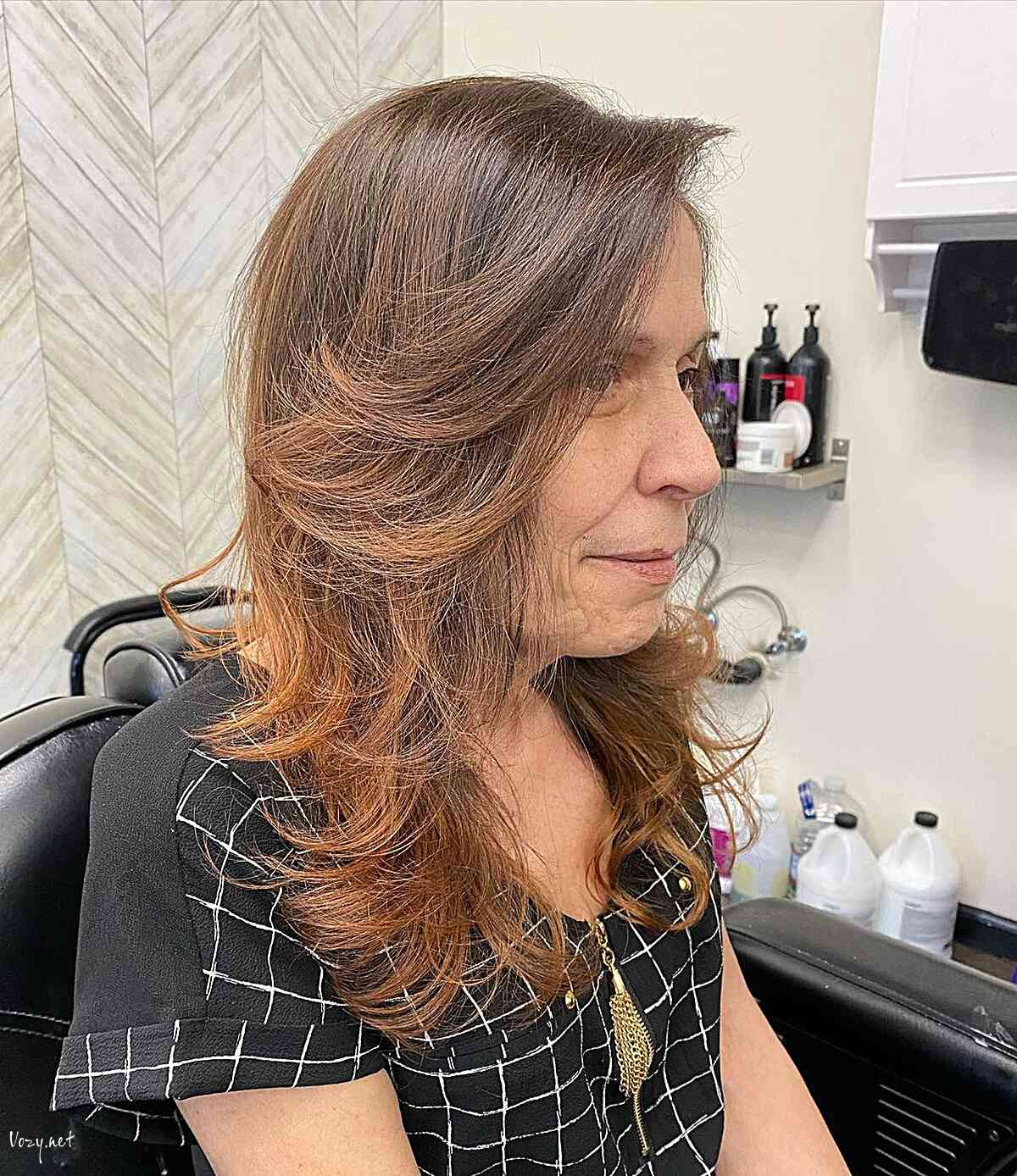 voluminous long feathered layers and bangs on older ladies past 60