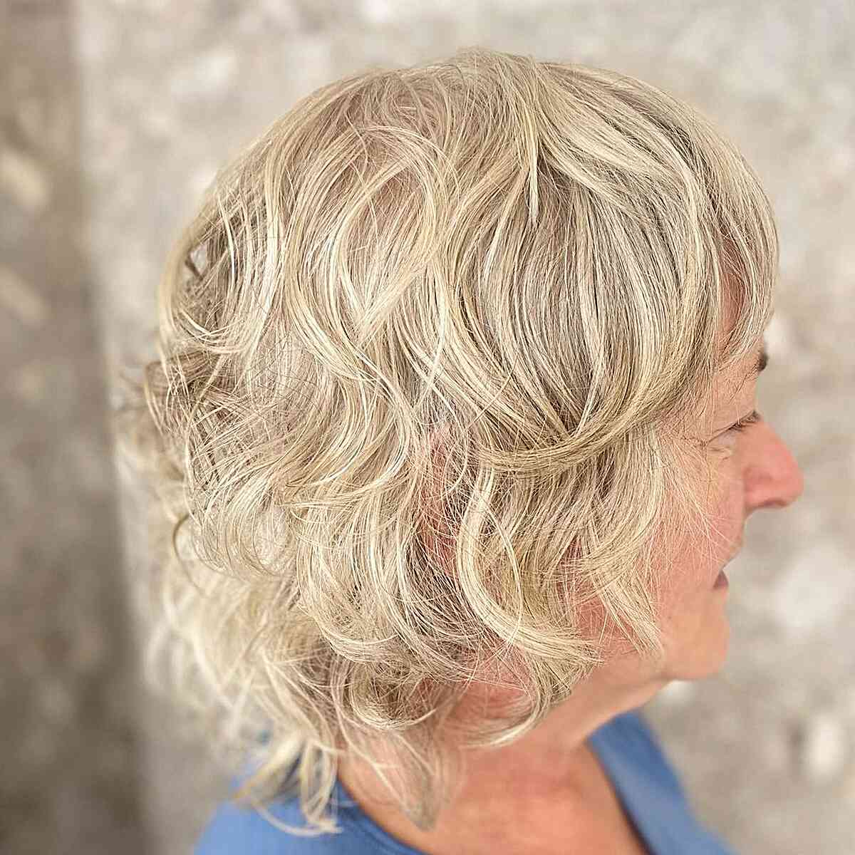 wavy blonde razor cut shag on old women
