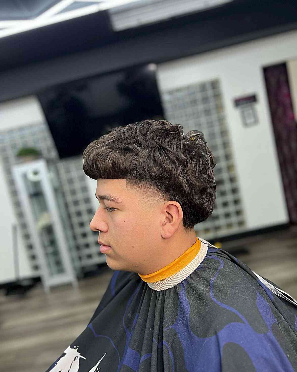 wavy edgar cut with temp skin fade