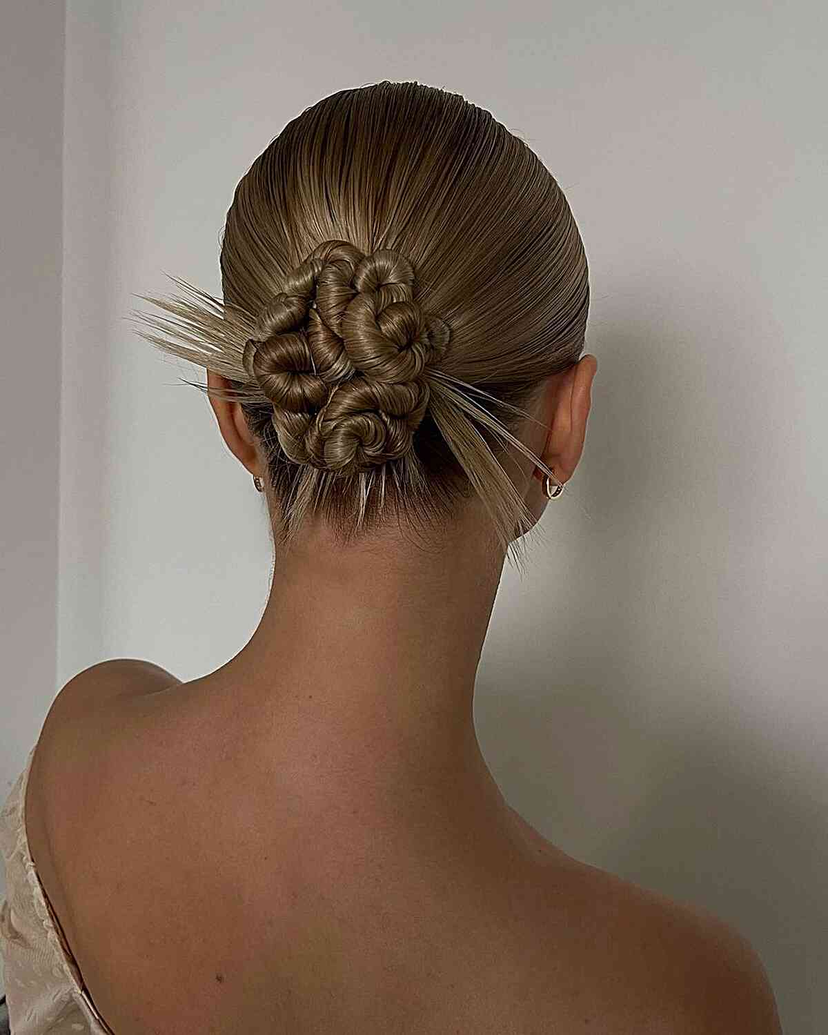 y2k low updo with swirls and spikes