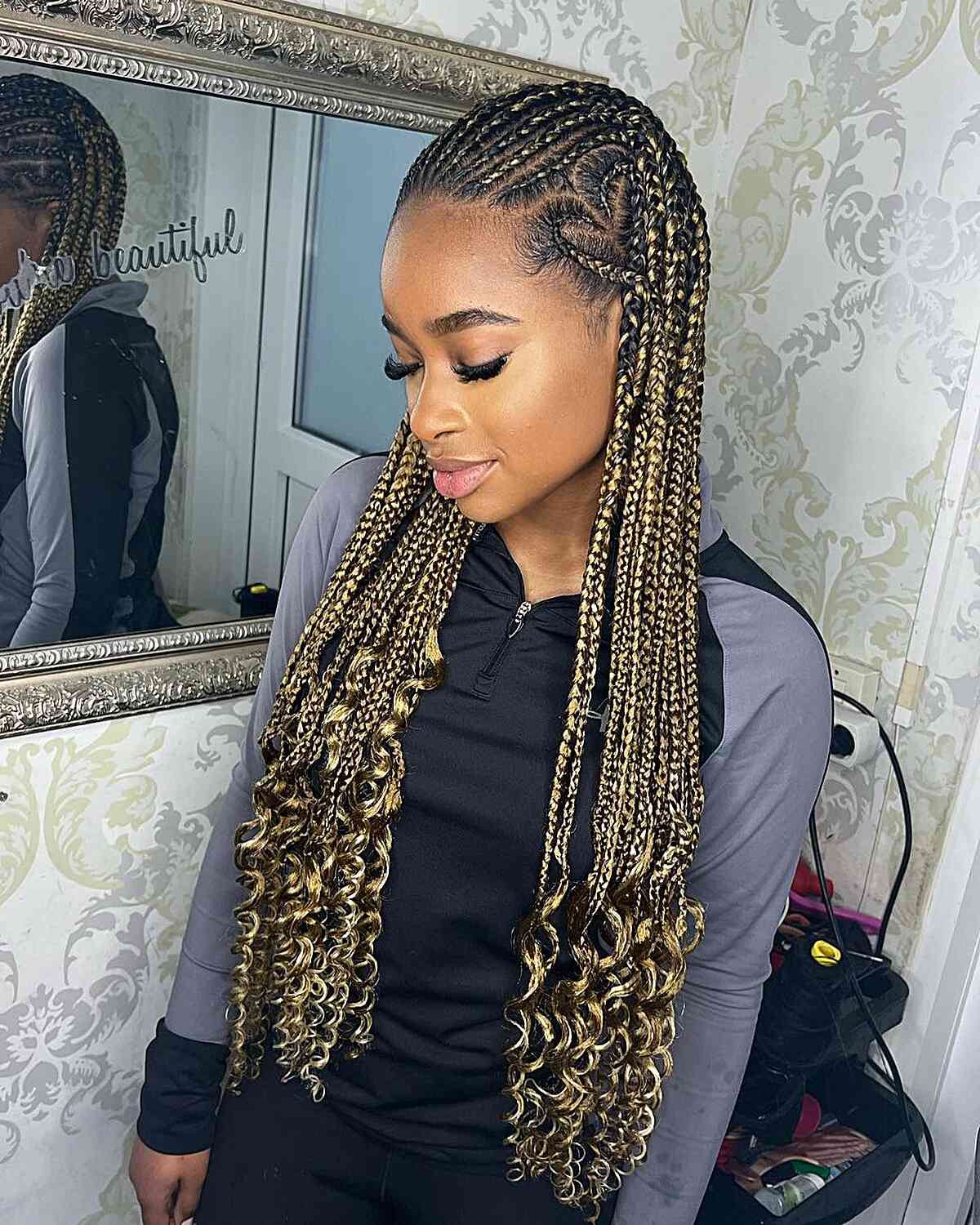 blonde knotless fulani braids with curly ends