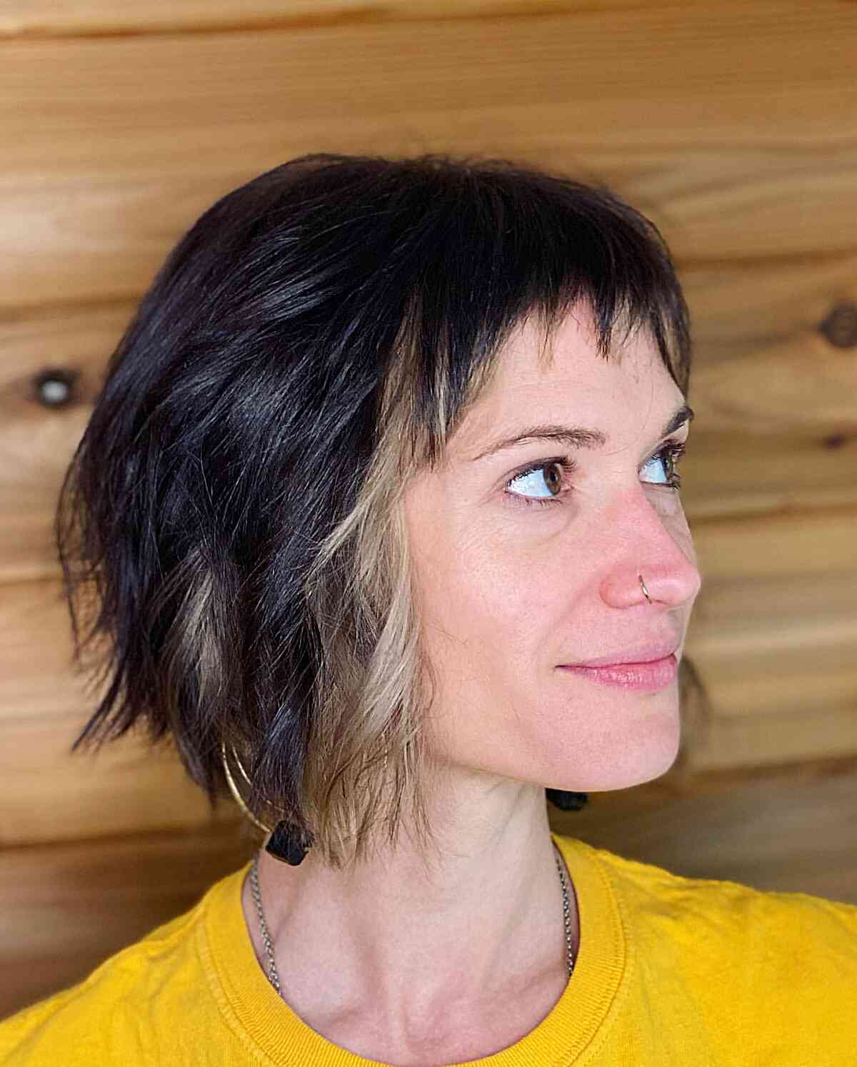 chin length textured bob cut with baby bangs