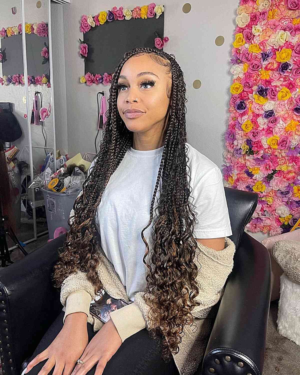 deep side part knotless braids with curls
