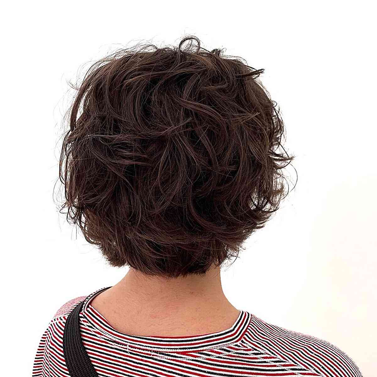 short textured curly bob with soft fringe