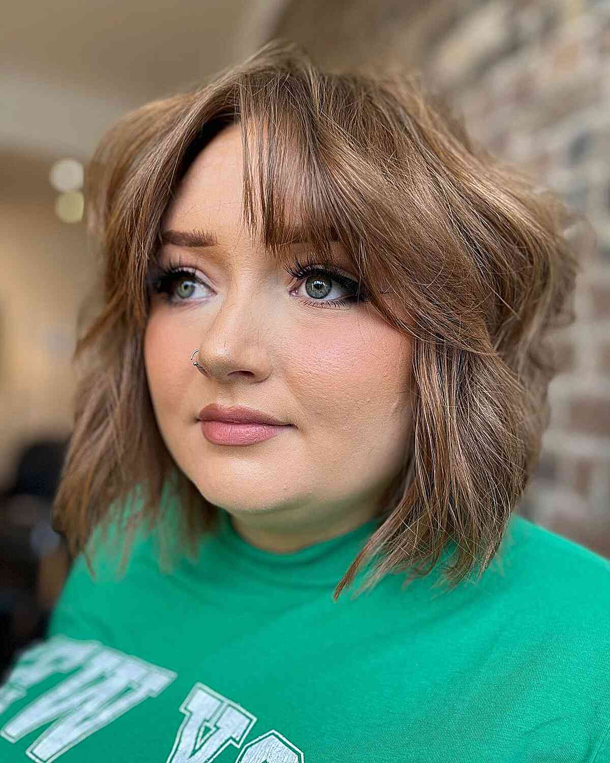 short voluminous textured bob with curtain bangs