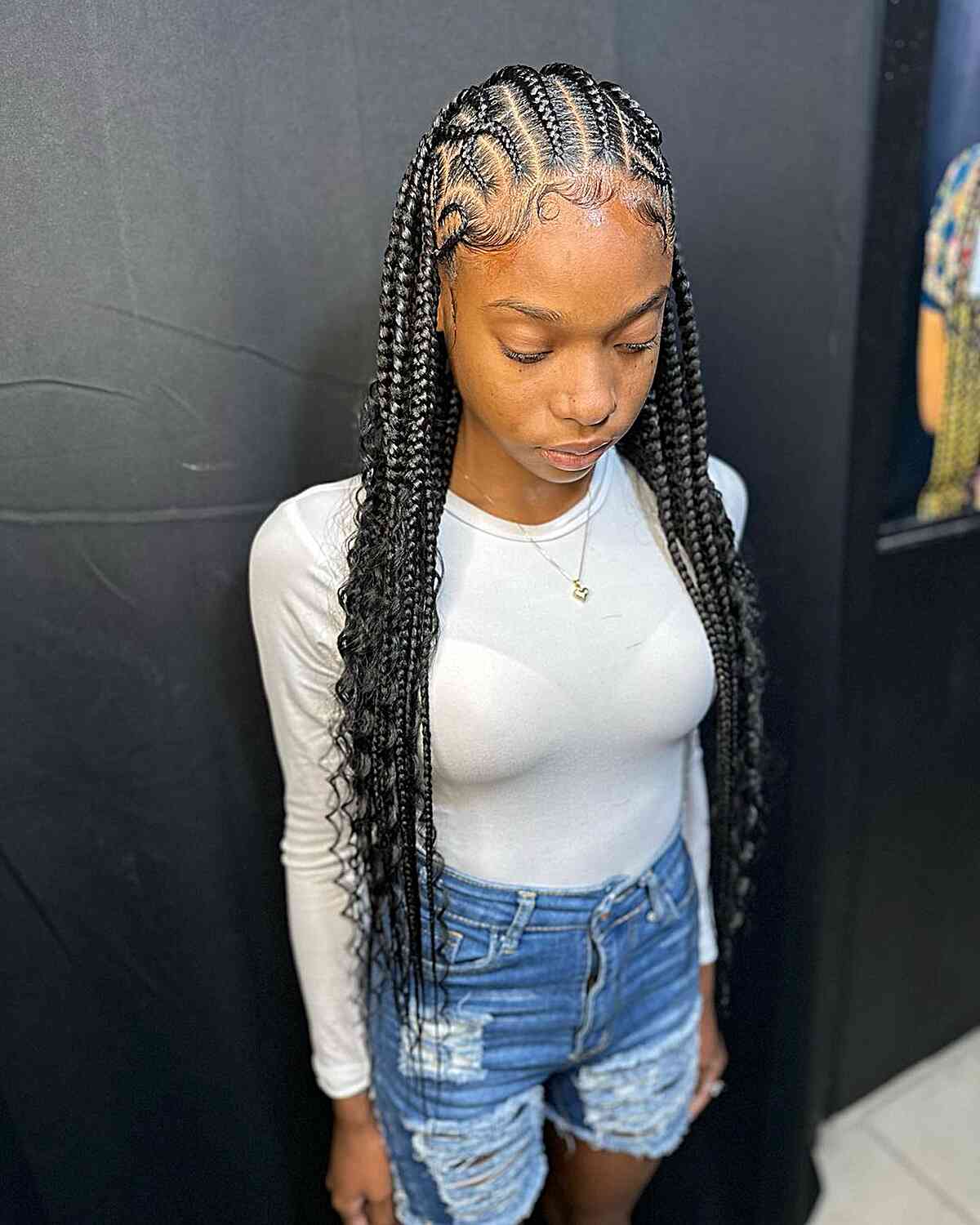 very long cornrows and knotless braids with unique parts