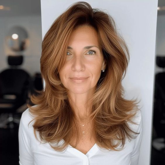Voluminous Layered Blowout with Golden Hues