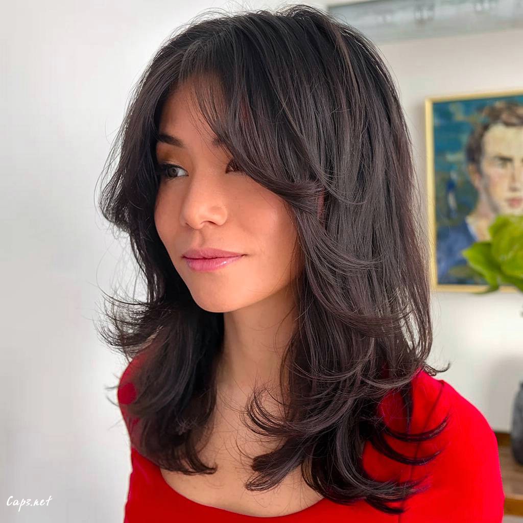 butterfly haircut with wispy curtain bangs