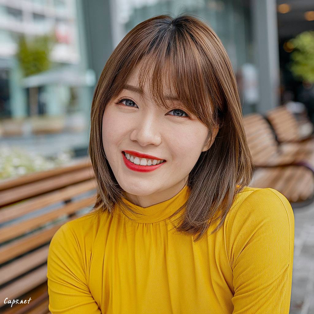 oval face haircut with long bangs